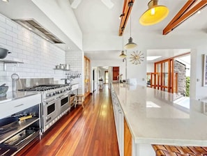 Channel your inner chef in the fully equipped gourmet kitchen, featuring a Viking range, Miele dishwashers, and a Nespresso machine—centred around memorable meals and shared laughter.