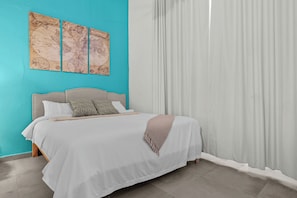 The comfortable bed and ample storage make this space both stylish and practical, offering a perfect retreat for relaxation.