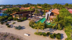 Villa Samba from a distance, showcasing its stunning architecture and surroundings