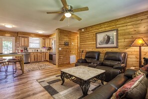 Cabin in Pigeon Forge "Happy Hollow Hideaway" - Living room and fully furnished kitchen