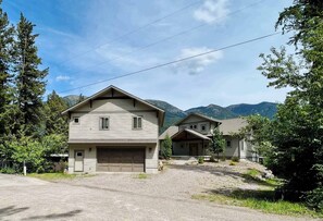 Heritage Suite is shown in the front and to the left of the main house. This listing only includes the garage suite. Read description for more details on renting the main home as well. Guest have access to hot tub, kayaks and front lawn w/Suite. 
