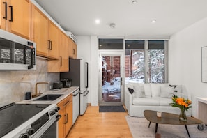 Your garden-level cozy, light-filled condo