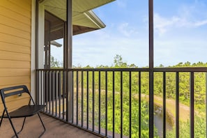 Enjoy the fresh air on the screened in balcony
