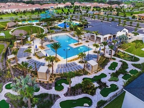 The Retreat Clubhouse, less than 1 mile from the house. Featuring zero entry pool, bar & restaurant, splash pad and waterpark slides! Free access for all guests!