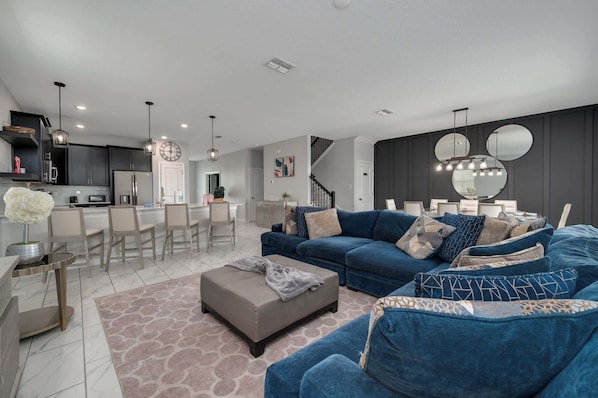 The beautiful and modern open floor plan connects the downstairs living room, dining room and kitchen, providing plenty of open space for everyone to be together!