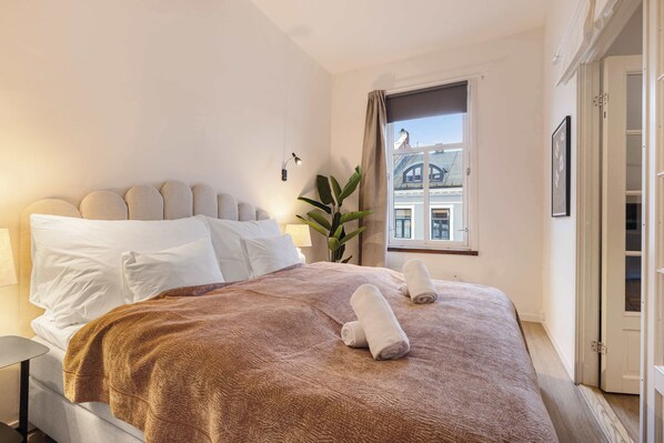 A peaceful space with soft bedding and a calming ambiance.