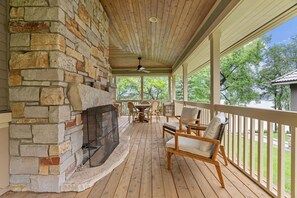 Outdoor fireplace on back porch