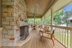 Outdoor fireplace on back porch