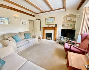 Fireplace in living room of The Cottage holiday cottage in, Padstow, North Cornwall