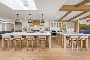 Chef’s kitchen- 2 stoves, island seating for 6, 1.5 dishwashers, wine fridge