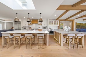Chef’s kitchen- 2 stoves, island seating for 6, 1.5 dishwashers, wine fridge
