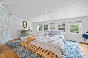 The primary bedroom has a super comfy king sized bed 