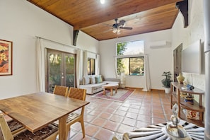 Living room with tall ceilings and ample natural light