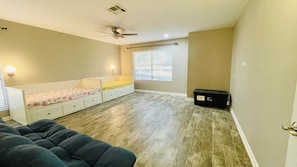 Bedroom 2 with 2 daybeds, can be converted into 2 double beds. Including games.