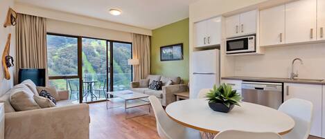 Living, dining, kitchen, balcony