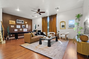 The living room combines rustic charm and comfort for a cozy, inviting feel.
