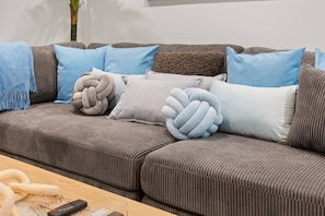 Extremely comfortable sofa with beautiful plush pillows and blankets. Fall asleep watching your favorite shows on Smart 75 Inch HDTV TV with roku/Netflix/Disney+ Super Fast WIFI~AC/ Heat for ultimate comfort during your stay.