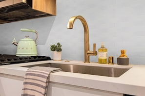 Dish Soap~Blender~Coffee maker~Tea~Tea Steeper~Hot Water Kettle~Children’s dinnerware~Cooking basics~Dishes and silverware~Dishwasher~Dishwasher Pods ~Ice Maker Freezer~Microwave~Oven~Refrigerator~Toaster~Wine glasses~Wine Opener~Cleaning products