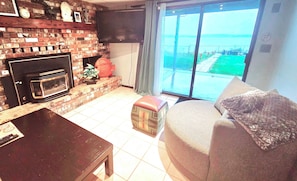 Living room with firepit patio in the distance