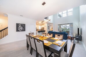 Comfortable dining room with seating for 8, plus 4 more at the kitchen bar for casual dining.