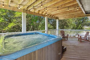 This dog-friendly home (2 dogs max) offers the perfect blend of comfort, convenience, and charm with a Private Pool, bubbly Hot Tub, and Screened-In Porch for cool evenings under the stars.