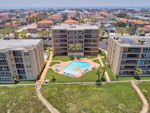 Aerial view from the beach to your complex! Building one is located on the left. This complex has two pools!