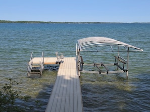 Enter the water from the dock stairs, 12ft end of dock suitable to tie any boat