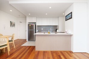 Open kitchen with bench space and views of Canberra’s skyline.