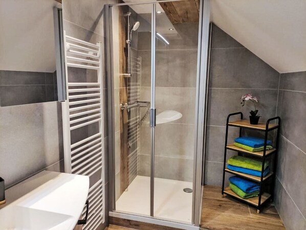 Flooring, Floor, Plumbing, Plumbing Fixture, Bathroom, Shower Door, Wood Flooring, Shower, Tile, Hardwood