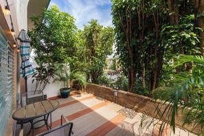 Enjoy your morning coffee or evening wine on this private lanai surrounded by lush tropical greenery.