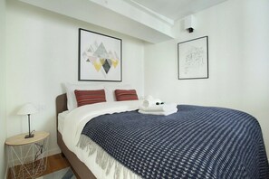 Chambre avec lit double
Bedroom with double bed