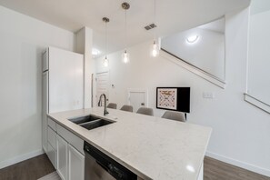 Cook, Dine, Relax in this Open Kitchen with Granite & Stainless Appliances.