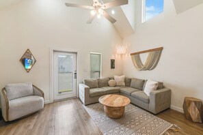 Relax in this spacious Living Room w/Vaulted Ceiling & Comfy Sleeper Sofa