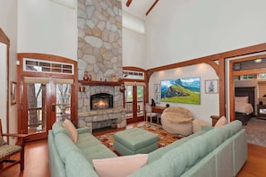 Living area with sectional seating and Smart TV