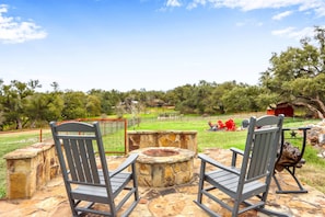 Fire pit area in the spacious back yard