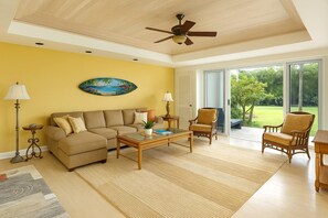 The living room features direct access to the private ground floor lanai, seamlessly blending indoor/outdoor living IML-D3