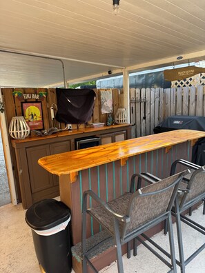 tiki bar with smart TV, mini-fridge, & grill