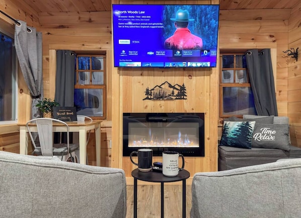 Relax in our cozy living room and stream your favorite shows on the Roku TV.