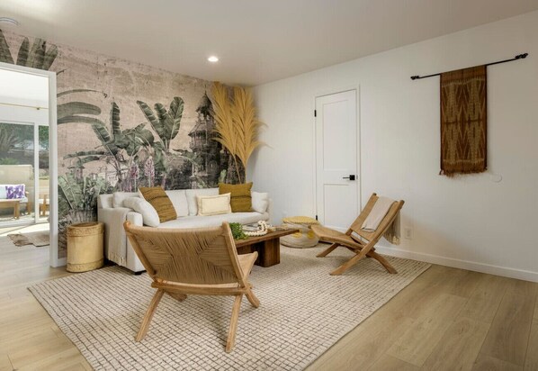 Another living room view displaying the sofa to be transformed into an additional bed.