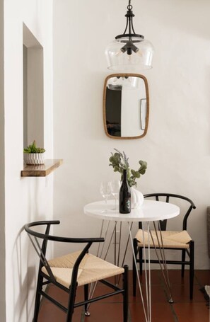 Start your day at this cozy café-style table, perfect for a light bite or a moment of calm.