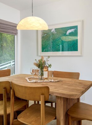 Dining area curated with authentic decorations from Indonesia for a unique and inviting atmosphere.