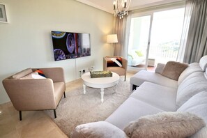 Step into a sunlit living room designed for comfort and connection, where modern style meets cozy charm and every window frames a view worth pausing for