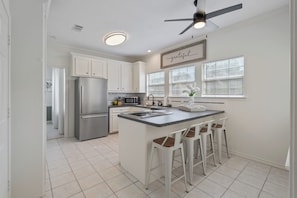 Cute kitchen with bar style seating