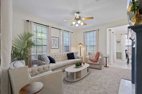 living room with deep seating and large TV