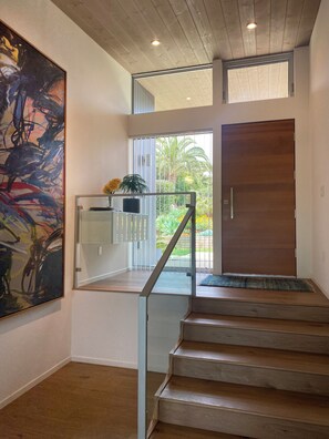 Stairs from front door to living area