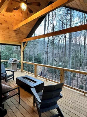 Upper grand deck with fire table and gas grill