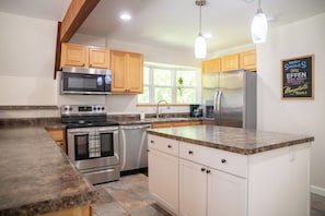 Full kitchen with stainless steel appliances