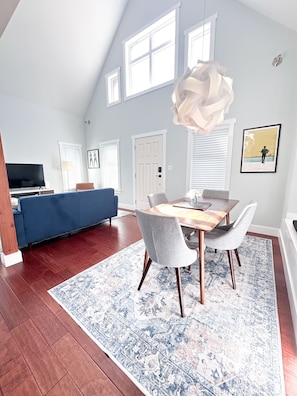 Dining table seating in bright and airy main living space.