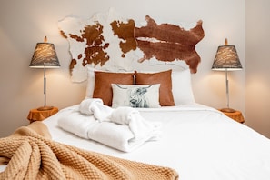 Relax and unwind in our cozy, character-filled bedroom designed for a restful night's sleep.