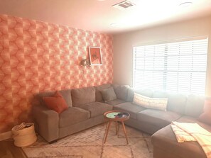 Secondary living space with TV, toys for the kiddos and a sleeper sofa. 